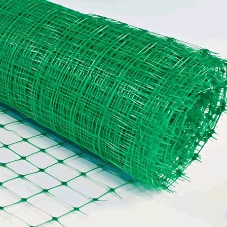 A roll of green extruded plastic netting with square mesh opening