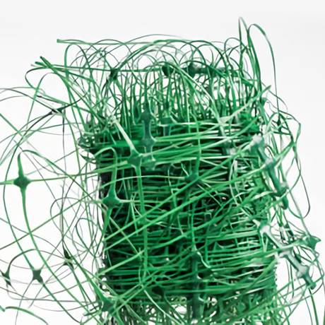 A roll of green stretched plastic netting for plant support