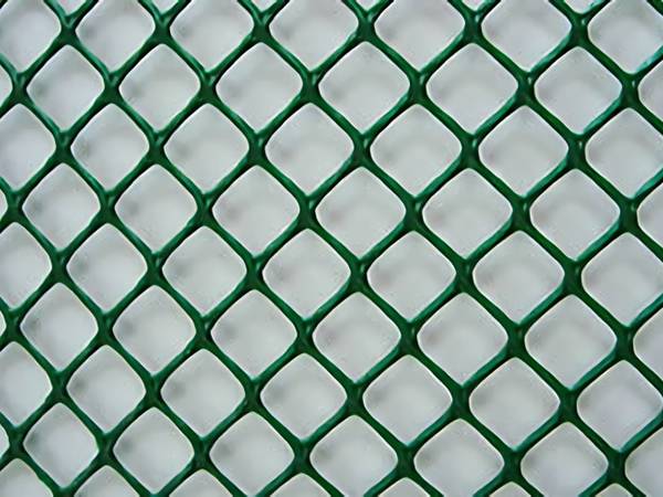 A piece of dark green diamond plastic flat netting
