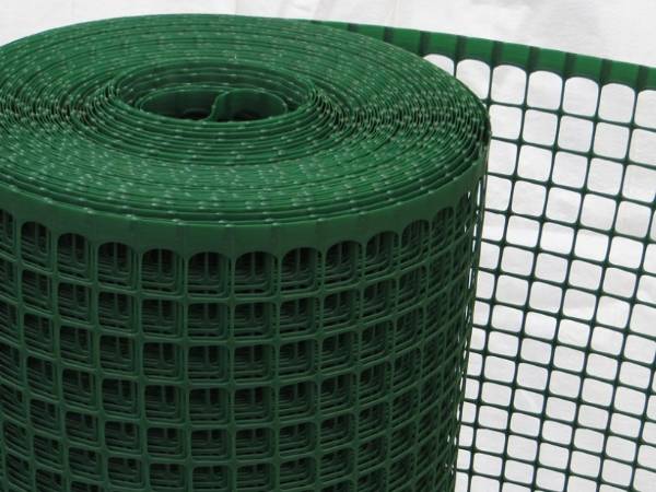 A roll of green extruded plastic netting