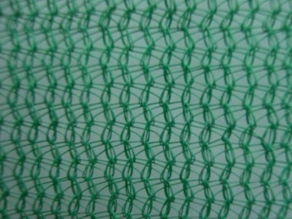Green knitted plastic sun shade netting with 60% shading.