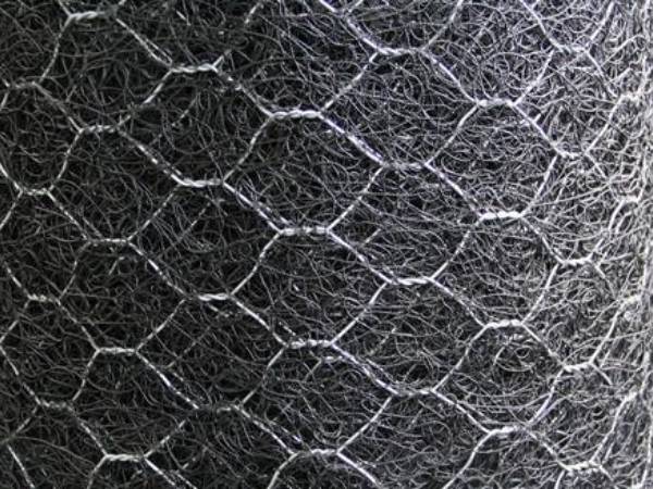 This is a roll of black hexagonal wire mesh reinforced 3D geomat.