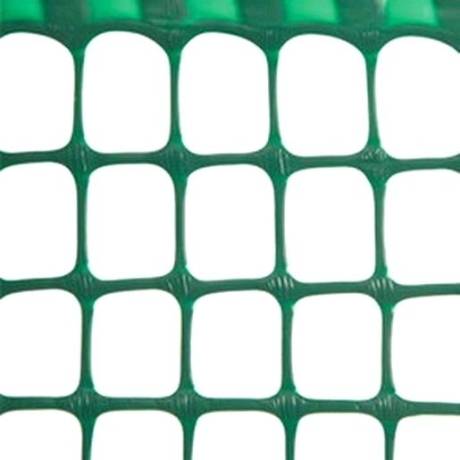 A piece of green square plastic safety netting